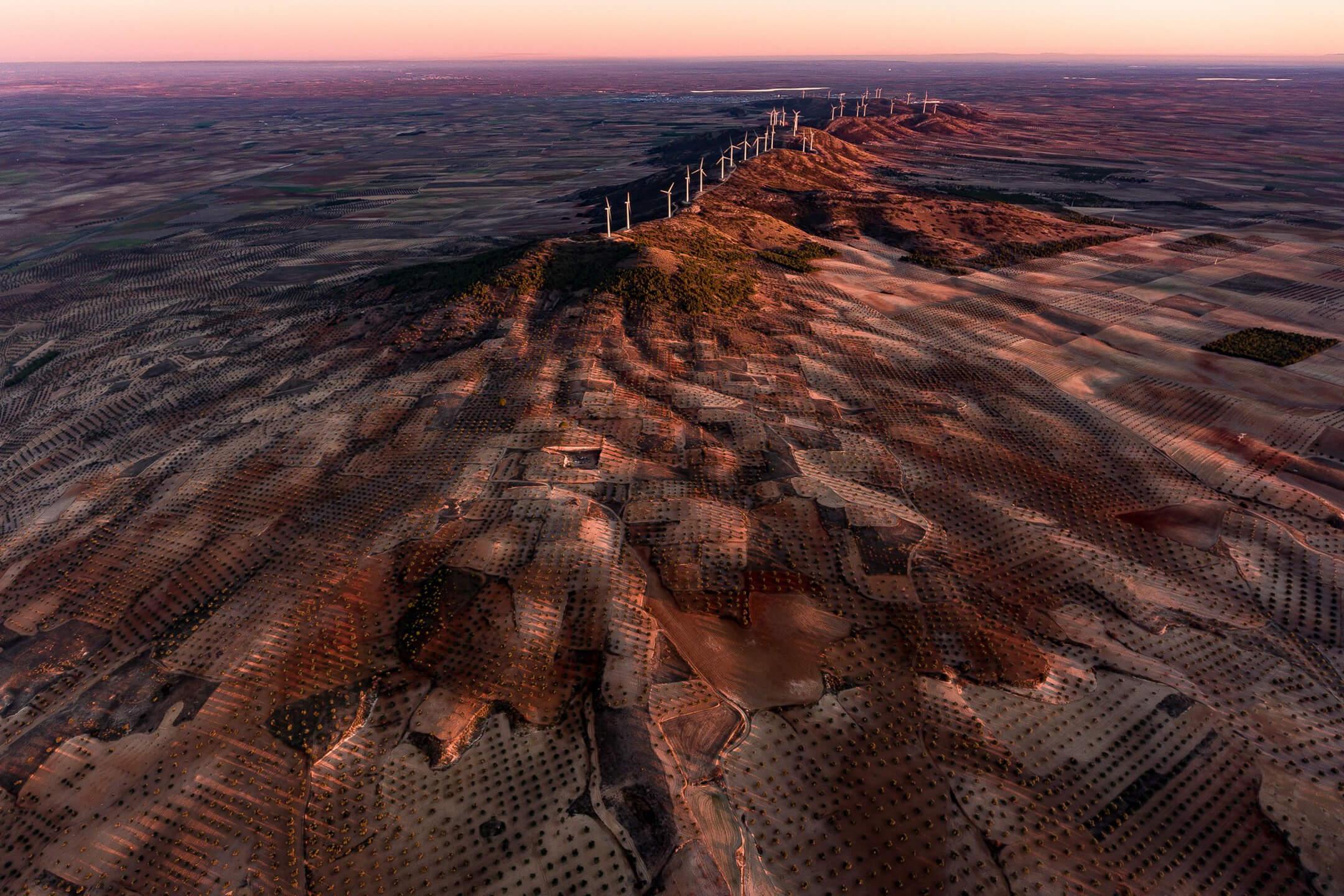 The Villacanas Wind Farm sits atop volcanic Mount El Romeral, taking advantage of the environmental topography.
Photographer: Milan Radisics   Location: Toledo, Spain 
