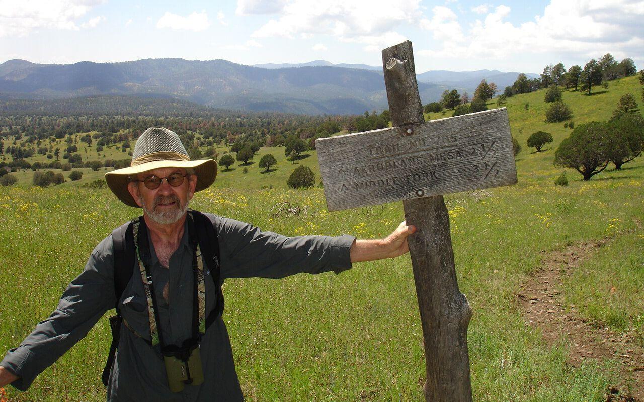 Dave Parsons at the head of a trail into the Gila Wilderness. All terrain behind him is part of the expansive Gila Wilderness - the first officially designated wilderness area in the world, so designated in 1924. The area in the far background behind him is the location of the release where he witnessed the return of Mexican wolves from the wilderness camp.
Photo: Dave Parsons