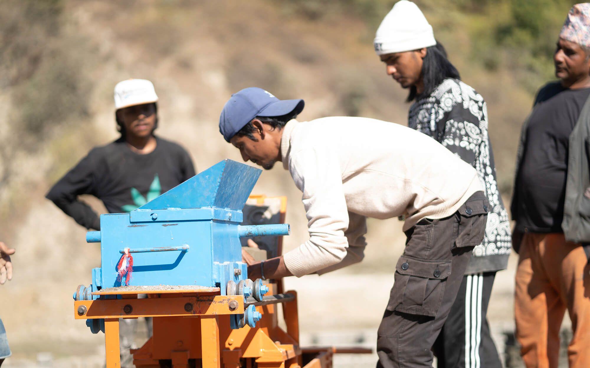 A Build Up Nepal entrepreneur makes eco-bricks in Jajarkot.
Photographer: Brand Brewers