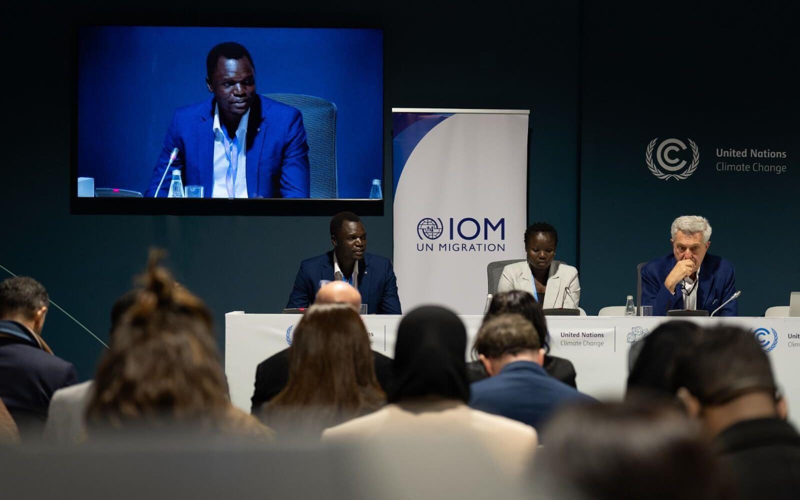 Opira Bosco Okot speaks at a UN climate change and migration conference. 
Photo: The Leads