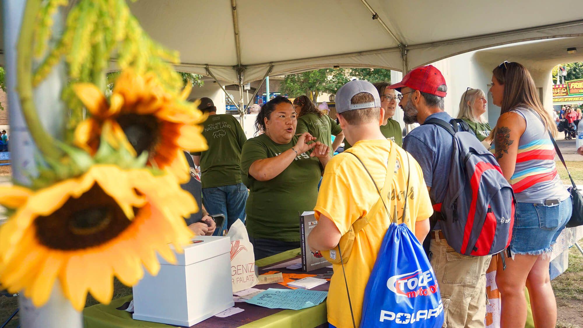 Linda Black Elk teaches fairgoers about plants in the NATIFS education tent at the Minnesota State Fair, 2023.
Photo: Maia Jacobson @ NATIFS