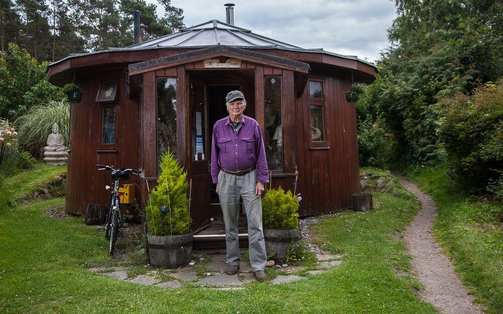 Roger Doudna outside ‘The Barrel’ – a cosy, wooden house he built from upcycled vats.
Photographer: Neil Baird